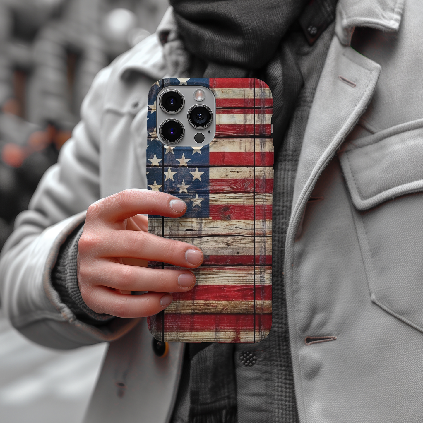 a person holding a phone case with an american flag on it